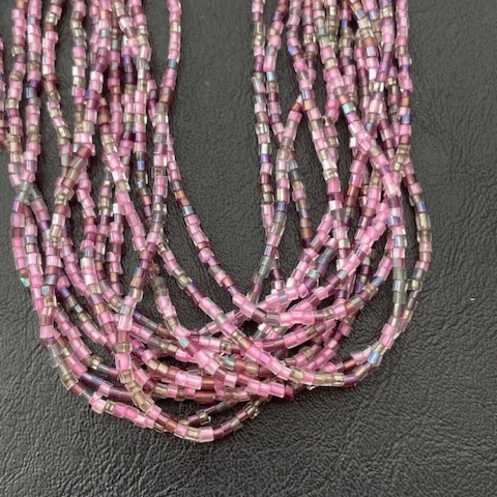Twisted necklace- light & dark pink beads with silver tone clasp